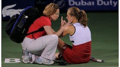Anna Chakvetadze of Russia is treated by medical staff after collapsing.