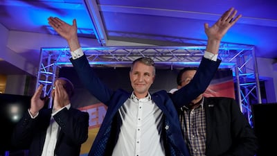 Thuringia chairman and top candidate of the Alternative for Germany (AfD) right-wing populist party Bjoern Hoecke (C) cheers next to AfD Brandenburg chairman Andreas Kalbitz (L) and AfD Bundestag member Stephan Brandner (R) on the evening of the Thuringia state elections at an AfD event in Erfurt, Germany, 27 October 2019. EPA/RONALD WITTEK