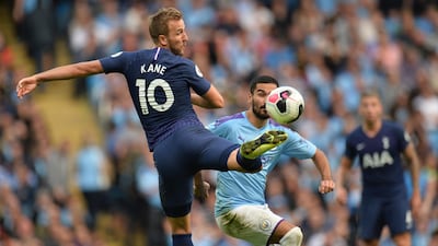 Tottenham Hotspur's Harry Kane (L) controls the ball during the English Premier League soccer match between Manchester City and Tottenham Hotspurs at the Etihad Stadium in Manchester, Britain. EPA