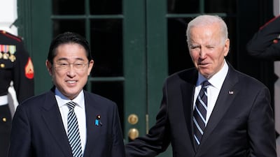 President Joe Biden greets Japanese Prime Minister Fumio Kishida at the White House in Washington. AP