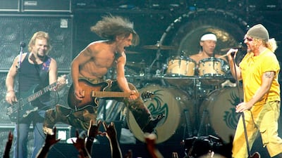 Members of the rock group Van Halen, from left, bassist Michael Anthony, guitarist Eddie Van Halen, drummer Alex Van Halen and singer Sammy Hagar, perform during the first of two sold-out shows at the Mandalay Bay Events Center in Las Vegas, Nevada late August 6, 2004. Reuters