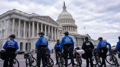 Capitol Police guard the perimeter of the compound. Getty / AFP