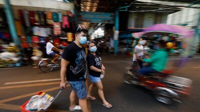 Filipinos walk through a market in Marikina City, Metro Manila, Philippines. Manila has reached the threshold of six uninterrupted months of quarantine and is heading towards the longest and strictest lockdown in the world. EPA