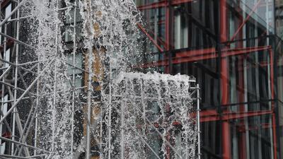 Danish-Icelandic artist Olafur Eliasson's work 'Waterfall' (2019) sits outside the Tate Modern. Photo: EPA