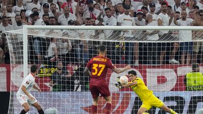 Sevilla goalkeeper Bono makes a save from Roma's Leonardo Spinazzola. AP