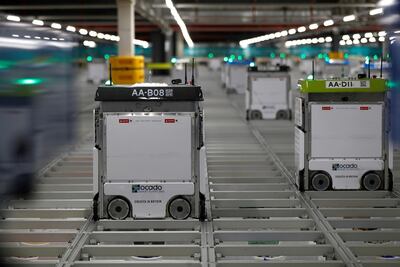 Robots operating on the grid of the 'smart platform' at the Ocado Customer Fulfilment Centre in Andover, where the fire occurred. Reuters