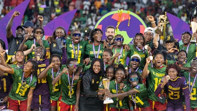 Cameroon celebrate with the trophy after defeating Malawi in the final of the Women's Africa Cup of Nations. EPA