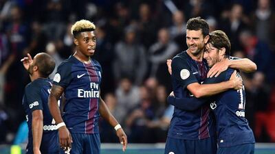 Paris Saint-Germain's Maxwell, right, celebrates after a goal with Thiago Motta, centre, and Presnel Kimpembe. Miguel Medina / AFP / September 20, 2016