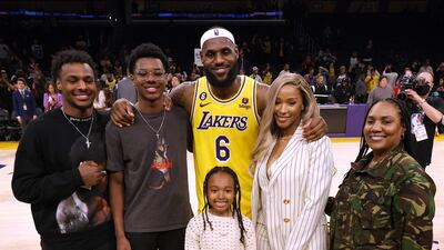 LeBron James with his family (from left) sons Bronny James, Bryce James, daughter Zhuri James, wife Savannah James and mother Gloria James. AFP