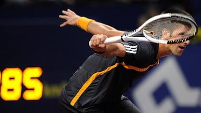 Novak Djokovic beat Roger Federer to win the Swiss Indoors in front of the world No 1's home fans in Basle on Sunday.