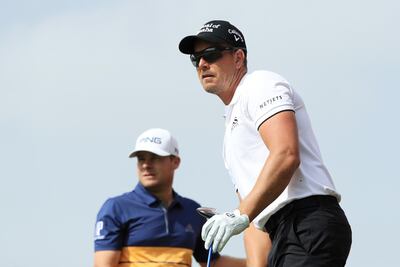 Henrik Stenson of Sweden, right, and Tyrrell Hatton of England look on from the second tee during the final round of the Abu Dhabi HSBC Championship. Andrew Redington/Getty Images
