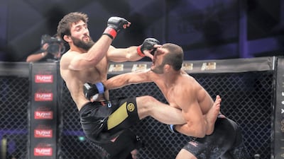 Jarrah Al Selawi, right, lands a blow on welterweight champion Abdoul Abdouraguimov during the Brave Combat Federation 27 main at the Mubadala Arena in Abu Dhabi. All photos Victor Besa / The National
