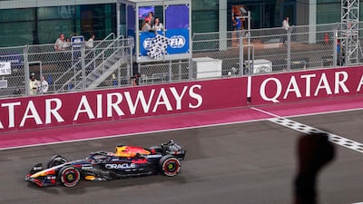 Red Bull 's Dutch driver Max Verstappen crosses the finish line to win the Qatar Grand Prix. AFP