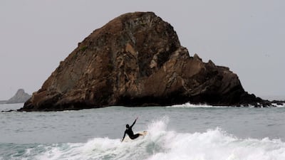 A surfer enjoys the large waves caused by Cyclone Phet at Snoopy Island in Fujairah on June 4, 2010. Stephen Lock / The National