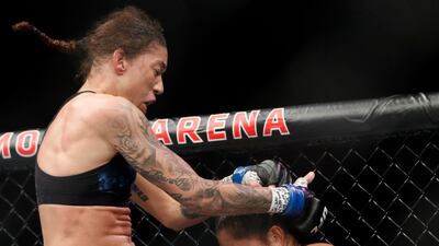 Germaine de Randamie lands a knee to Amanda Nunes. AP
