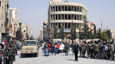 This photo released by the Syrian official news agency SANA, shows forces loyal to Syrian president Bashar Al Assad being deployed in the town of Yabroud, Syria on March 16. Syrian troops backed by Hizbollah fighters seized the key rebel town on the Lebanese border, driving them from the area and scoring a major blow against them in the three-year-old-conflict. SANA/AP