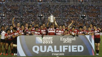 Japan rugby captain Michael Leitch lifts the Asian Five Nations trophy after their victory, which qualified them for the 2015 Rugby World Cup, over Hong Kong on Sunday. Yuya Shino / Reuters / May 25, 2014