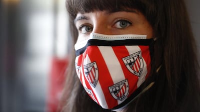 An Athletic Bilbao staff member wears a protective face mask. EPA