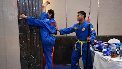 Members of Myanmar's vovinam martial arts team warm up before competing in the 32nd South-East Asian Games in Phnom Penh, Cambodia, on Saturday. AFP
