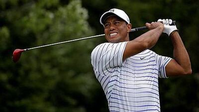 Tiger Woods winces after tee shot on the sixth hole during the second round of the PGA Championship golf tournament at Valhalla Golf Club in Louisville, Ky. Woods removed himself from consideration for the Ryder Cup team Wednesday evening, Aug. 13, 2014 with a clear message that he is not healthy enough to play. (AP Photo/Jeff Roberson, File)
