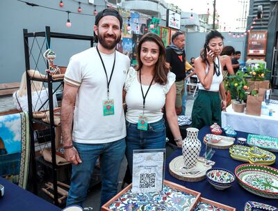 Rawan Badarneh and husband Mohamed Al Kaggoumi at their souq stall Fyrouzi Ceramics. Victor Besa / The National