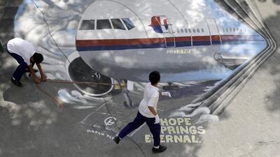 Schoolboy artists in Manila in the Philippines draw a playground tribute to the missing Malaysia Airlines Flight MH370 Boeing 777, whose fate has enthralled the entire world for days. Francis R Malasig / EPA