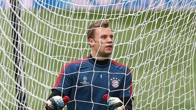 Goalkeeper Manuel Neuer stretches during their FC Bayern Muenchen training at the Santiago Bernabeu Stadium ahead of the UEFA Champions League semi-final first leg match against Real Madridon April 22, 2014 in Madrid, Spain. Martin Rose/Bongarts/Getty Images