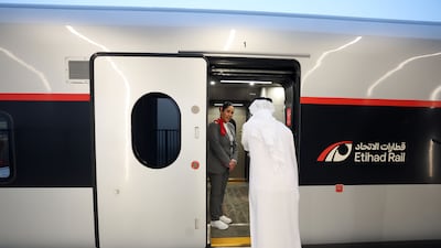 A passenger prepares to board the train.