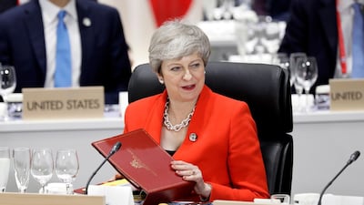 British Prime Minister Theresa May attends a working lunch during what will be her final G20 summit. EPA
