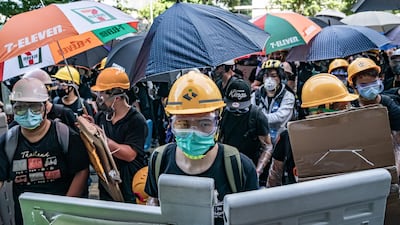 Protesters smash glass doors and windows of the Legislative Council Complex in Hong Kong, China. Getty Images