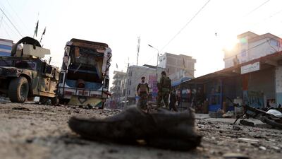 Afghan security officials inspect the scene of a suicide bombing in Jalalabad on December 3, 2017. Ghulamullah Habibi / EPA