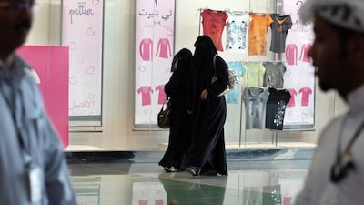 Saudi women walk at a shopping mall in the Saudi Arabian capital of Riyadh. Hassan Ammar / AFP Photo