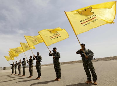 Members of the Syrian Democratic Forces (SDF), trained by the US-led coalition, participate in the graduation ceremony of their first regiment in al-Kasrah, in the suburb of eastern Syrian city of Deir al-Zor, on May 21, 2018. (AFP/Delil souleiman)