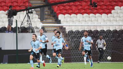 Baniyas, light blue, had plenty to celebrate against Al Jazira, but the biggest cheers came from Al Ain, who were handed the AGL title on Jazira's loss. Mona Al Marzooqi/ The National