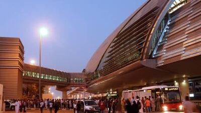Passengers queue for south-bound buses in Dubai after being stranded by technical problems on the city's mass transit rail system.