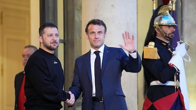 French President Emmanuel Macron, centre, welcomes Ukrainian President Volodymyr Zelenskyy at the Elysee Palace on May 14. AP