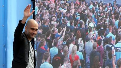 Manchester City's new Manager Pep Guardiola is unveiled during a media day at the Etihad campus on Sunday. Nigel Roddis / Getty Images / July 3, 2016