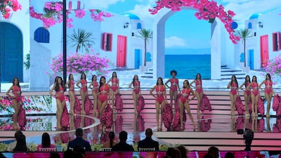 Contestants pose in swimsuits during the competition. EPA