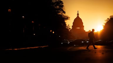 A pedestrian near the US Capitol during sunrise on November 5, the day the government shutdown became the longest in history. Getty Images / AFP