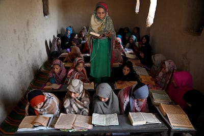 Afghan girls read the Quran in a traditional classroom at the Al Subhan madrassa. AFP