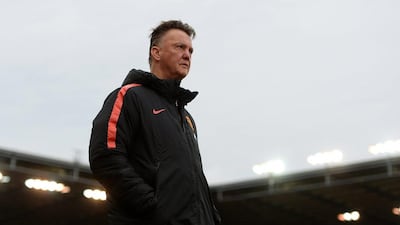 Manchester United manager Louis van Gaal observes his side's 1-1 Premier League draw with Stoke City on Thursday at the Britannia Stadium. Gareth Copley / Getty Images / January 1, 2015