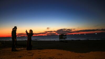 A Palestinian couple takes a selfie at the beach in Gaza City. EPA