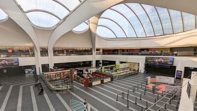 Passengers walk through a near-empty Birmingham New Street station. PA