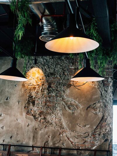 A hand-chipped artwork on a brick wall