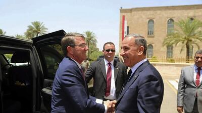 US defence aecretary Ash Carter, left, shakes hands with Iraqi defence minister Khaled Al Obeidi at the defence ministry in Baghdad. AP Photo