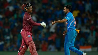 Shimron Hetmyer is congratulated by India's Deepak Chahar after his dismissal at the MA Chidambaram Stadium in Chennai. AFP