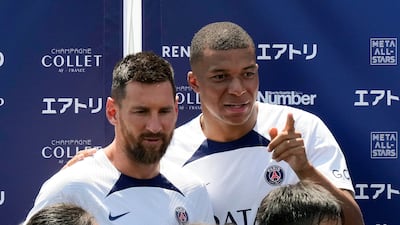 Paris Saint-Germain's Kylian Mbappe, right, and Lionel Messi. EPA