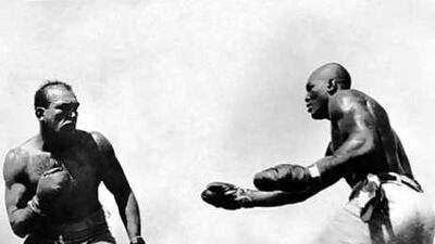 In this photo taken July 4, 1910, Jack Johnson, right, fights "Great White Hope" Jim Jeffries in Reno, Nevada.