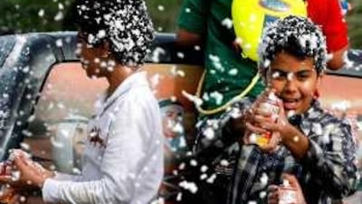 Boys spray foam during National Day. Hospital officials say the foam can cause burns.