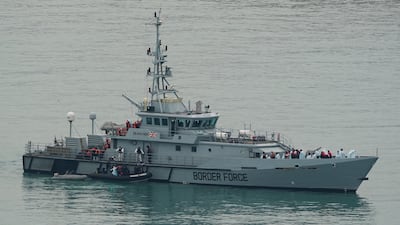 A Border Force vessel carries people thought to be migrants into Dover, Kent, following a small boat incident in the Channel. PA